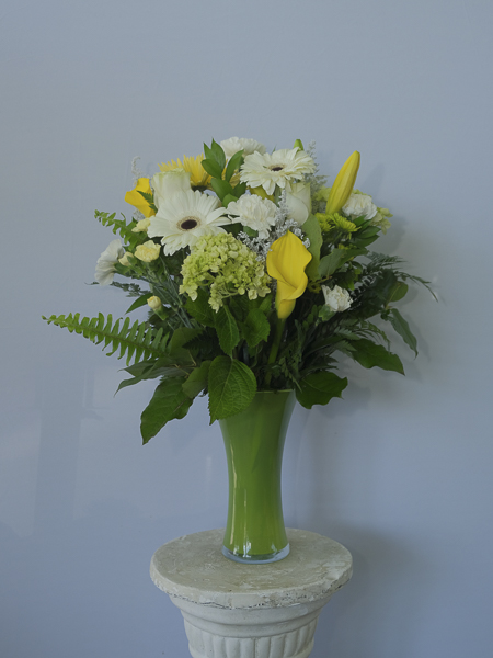 Green Vase with white and yellow flowers