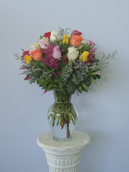 White, Yellow, Orange and pink roses in vase
